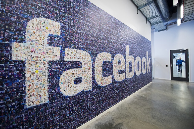 A big logo created from pictures of Facebook users worldwide is pictured in the company's Data Center, its first outside the US on November 7, 2013 in Lulea, in Swedish Lapland. The company began construction on the facility in October 2011 and went live on June 12, 2013 and are 100% run on hydro power. AFP PHOTO/JONATHAN NACKSTRAND